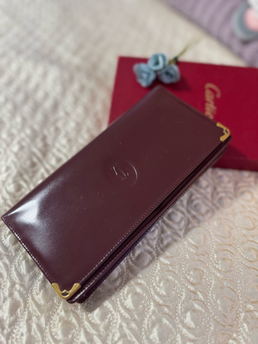 Cartier Deep Burgundy Leather Continental Wallet with Gold Corner Accents